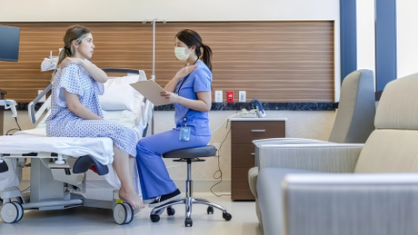 clinical-blue plastic stool in an exam room.jpg